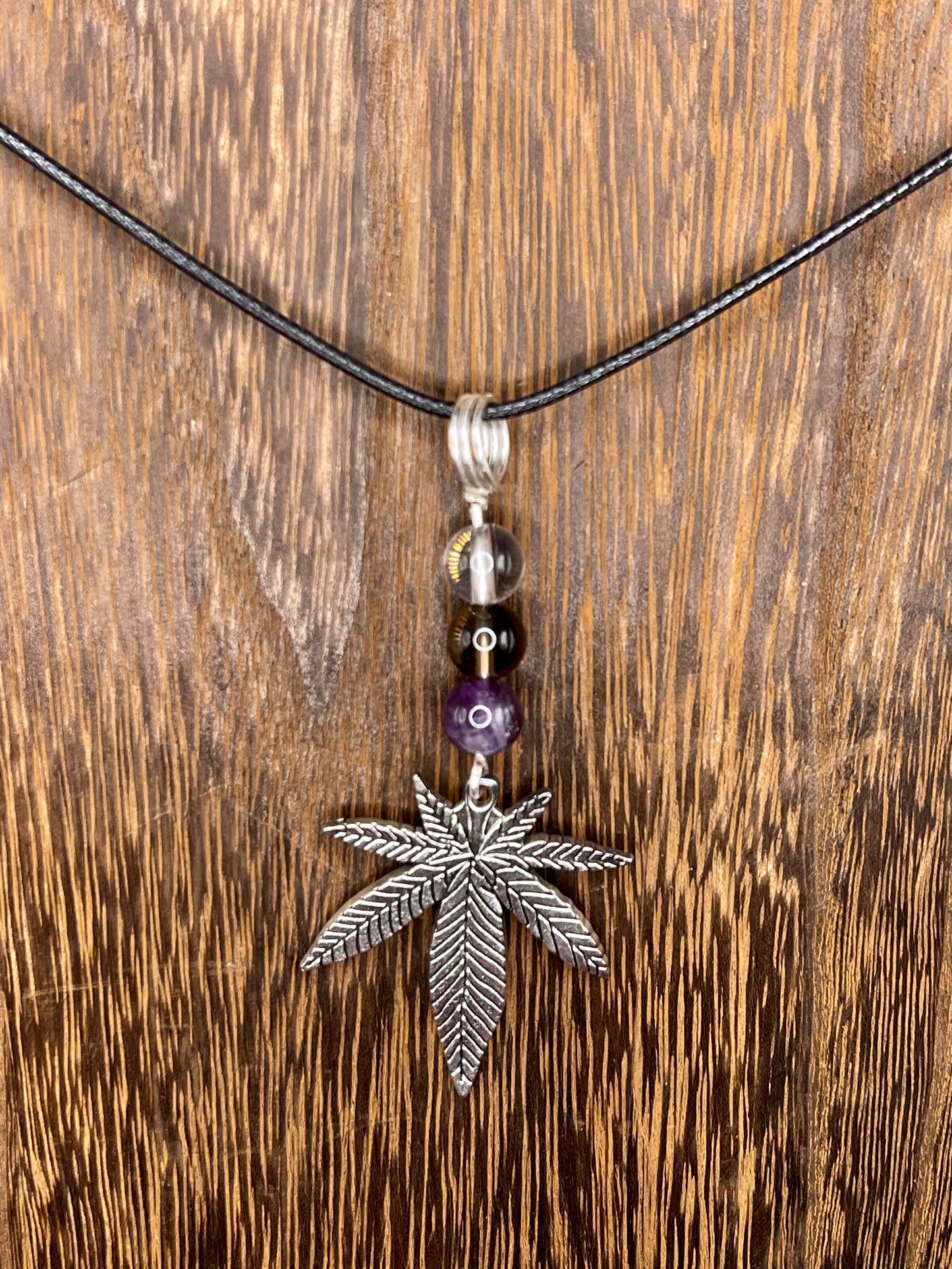 ✨ Nature’s Harmony: Clear Quartz, Smoky Quartz and Amethyst Crystal Necklace with Marijuana Leaf Charm ✨