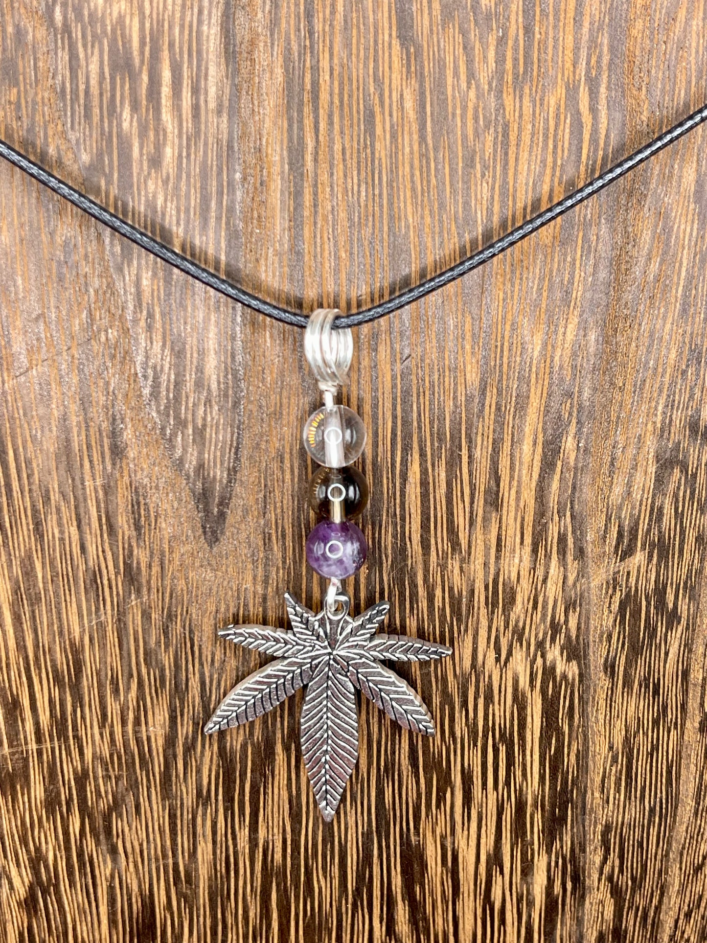 ✨ Nature’s Harmony: Clear Quartz, Smoky Quartz and Amethyst Crystal Necklace with Marijuana Leaf Charm ✨